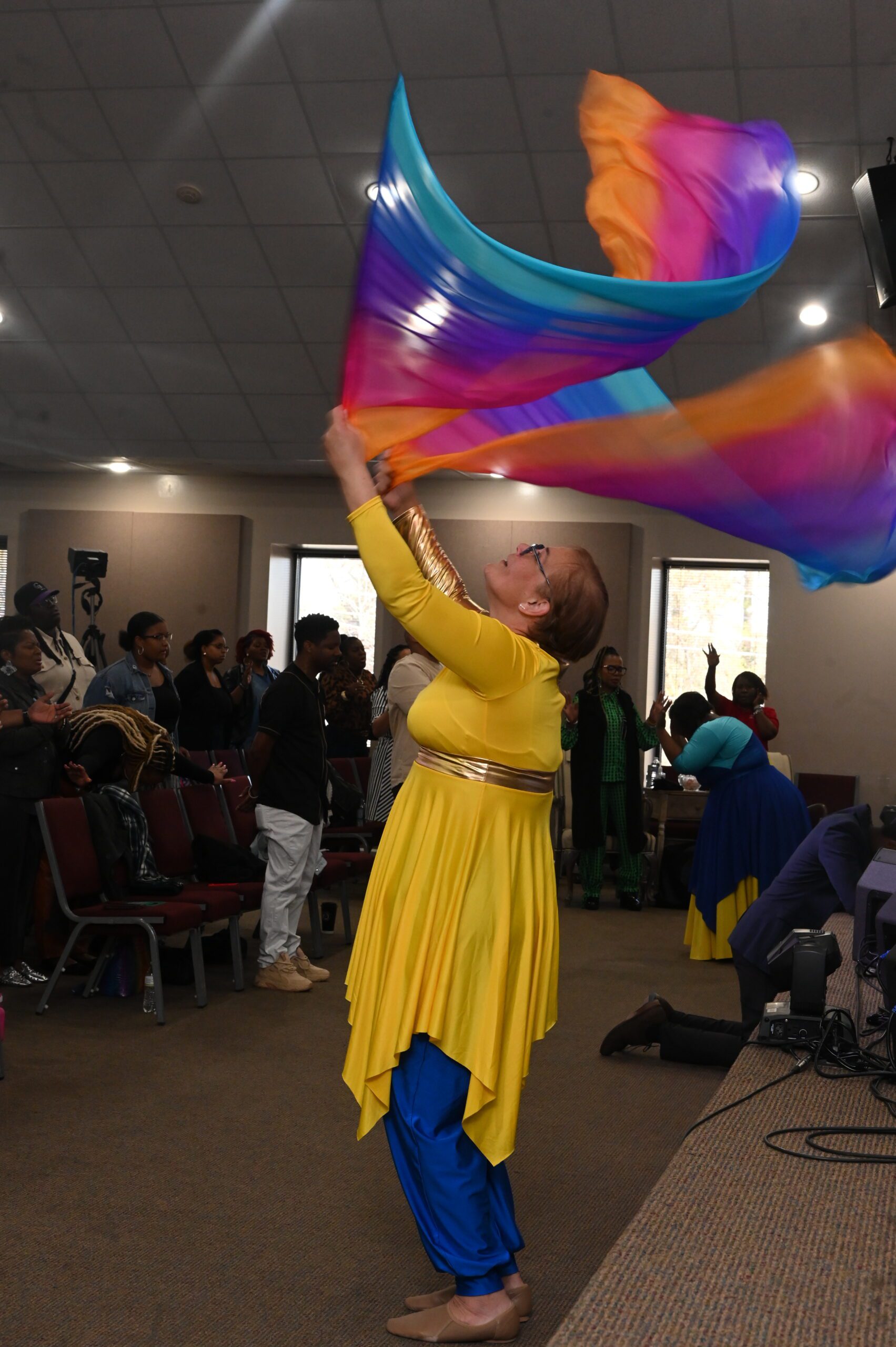 Smiling volunteers serving and worshipping together